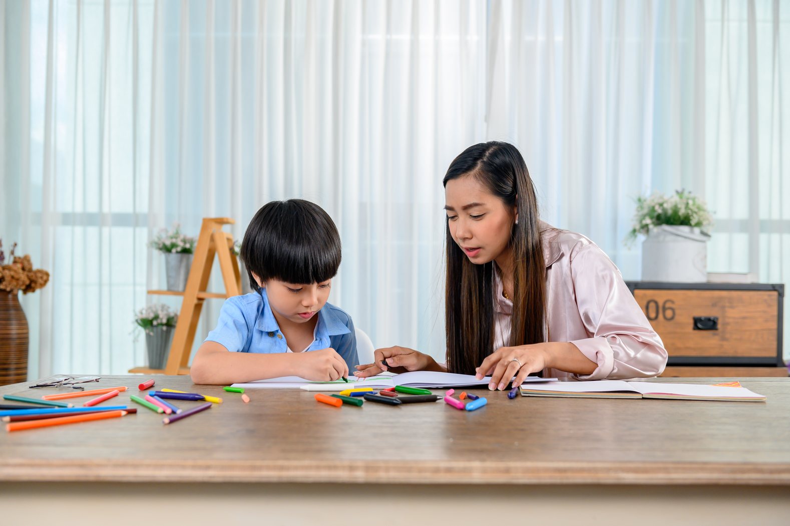 Student working through learning activities at a table