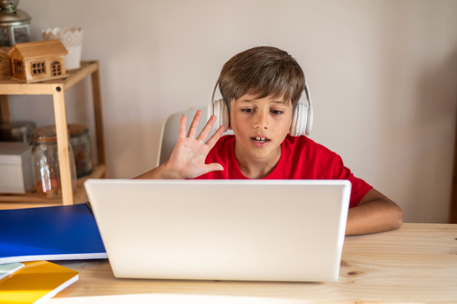 Child learning online from home using a laptop